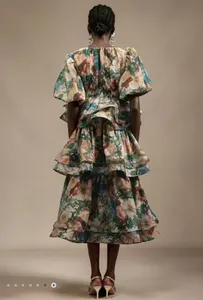 Detailed back view of a floral tiered ruffle dress with puff sleeves and layered skirt