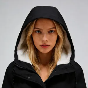 Professional detail view of a black women's commuter jacket showing soft white fleece lining