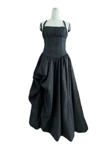 French romantic black halter neck dress with boned bodice and irregular pleated skirt.