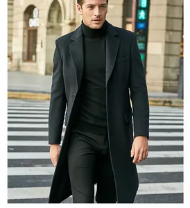 Sophisticated men's black long wool coat styled with a turtleneck sweater
