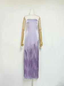 Close-up detail of a lavender acetate sleeveless dress featuring a long fringe hem