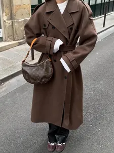 Elegant full-length brown wool blend coat with wide lapels and waist belt for women