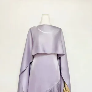Close-up detail of a purple acetate fringe dress with a matching elegant satin shrug