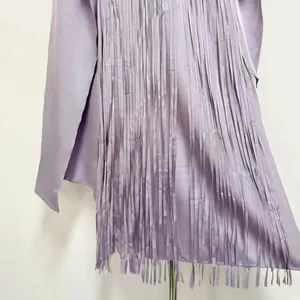 Close-up of lavender acetate fringe dress with silky satin finish and matching shrug