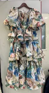 Detailed view of a plus-size floral print tiered ruffle dress with puff sleeves and high waist