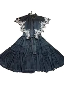 Elegant black A-line ruffle midi dress featuring white floral embroidery and a belted waistline