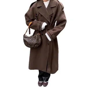 Elegant brown long wool trench coat with lapel collar and waist belt for women's winter