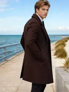 Classic dark brown mid-length wool blend coat for men in a scenic outdoor setting.