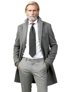 Stylish detail of a grey wool overcoat styled with a white shirt and tie for a professional look.