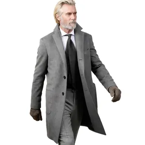 Professional mature man in classic grey mid-length wool overcoat for autumn and winter