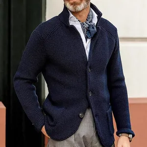 Close-up of navy blue men's knitted cardigan jacket with button details and texture.