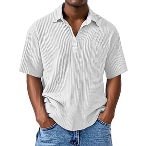 Close-up detail of white double-layer crepe fabric on a men's short sleeve polo shirt
