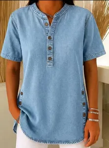 Close-up of buttoned notch neckline and side details on light blue denim t-shirt
