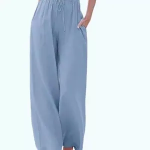 Comfortable women's linen wide-leg trousers featuring drawstring waist and pockets