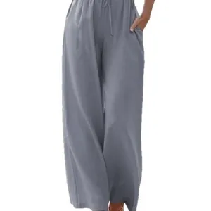 Detailed macro view of grey linen-style wide-leg casual pants with drawstring