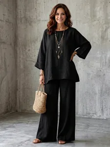 Detail showing the relaxed fit and linen-blend texture of this black two-piece set.