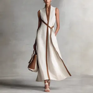 Elegant white sleeveless V-neck linen maxi dress with brown contrast trim detail