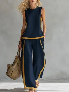 Elegante completo due pezzi smanicato blu navy e giallo con pantaloni a gamba larga estivi.