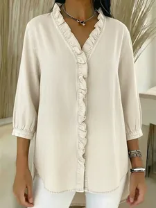 Elegant solid color blouse with ruffled V-neck and denim texture for stylish casual wear.
