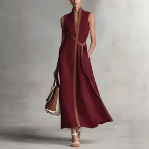 Elegant V-neck sleeveless cotton linen dress with stylish contrast trim details.