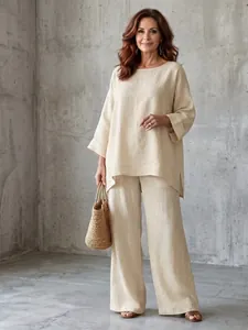 Elegant beige cotton-linen two-piece set with loose tunic and wide-leg trousers