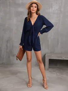 Tutina blu navy a maniche lunghe con nodo sul davanti e scollo a V molto elegante