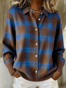 Close-up detail of a brown and blue plaid knit sweater with contrast collar and buttons