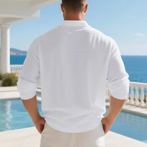 Back view of a breathable men's white long-sleeve linen shirt in a casual resort setting