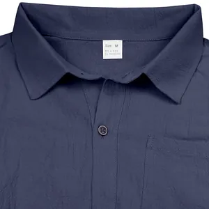 Macro view of breathable navy linen shirt fabric showing collar and material tag