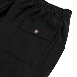 Close-up of elastic waistband and cargo pocket on men's black linen pants