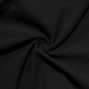 Close-up detail of black breathable linen fabric texture for men's casual beach pants