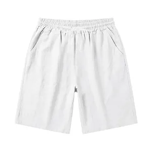 Detail view of men's white linen shorts featuring elastic drawstring waist and side pockets