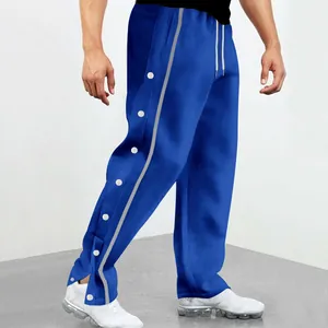 Pantalon de sport bleu pour homme à coupe droite avec boutons-pression latéraux et rayure