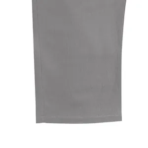 Detailed close-up of grey linen trousers hem showing texture and quality stitching