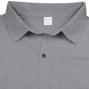 Close-up detail of a grey linen blend men's casual shirt with collar and size tag