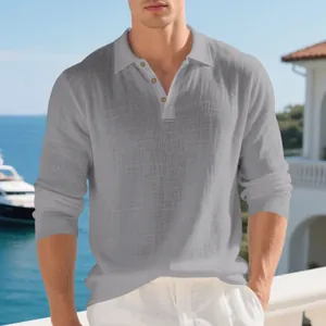 Macro view of men's grey linen polo shirt showing breathable fabric texture and collar