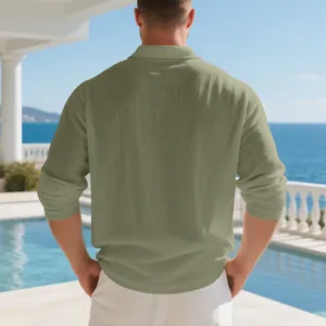 Back view of a men's olive green linen long sleeve polo shirt in a relaxed resort setting