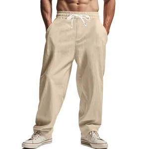 Close-up detail of men's loose linen-style casual beach pants with white drawstring