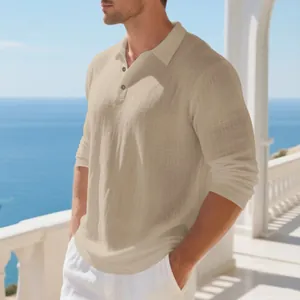 Detailed view of a breathable beige linen polo shirt for men at a sunny coastal balcony