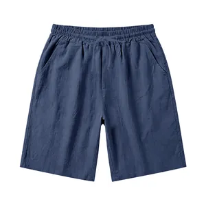 Detail view of men's casual blue linen shorts with drawstring elastic waist and pockets