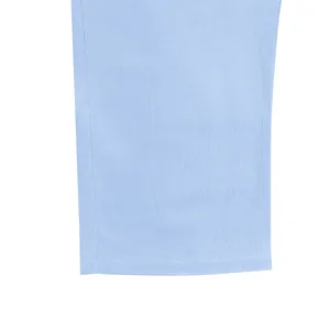 Detailed close-up of light blue linen trousers hem showing high-quality neat stitching