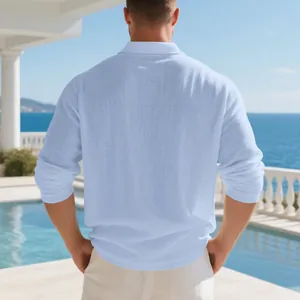 Back view of a men's light blue breathable linen long-sleeve polo shirt by the pool