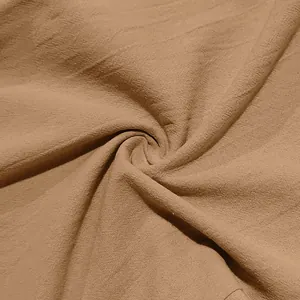 Macro detail of breathable brown linen fabric texture for men's casual beach pants