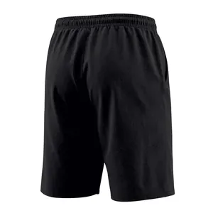 Rear view of minimalist black men's casual linen shorts featuring elastic waistband