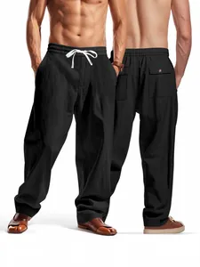 Men's loose casual black linen pants featuring a drawstring waist and straight leg cut.