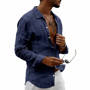 Detail of a men's navy blue linen long sleeve shirt featuring retro button lapel.