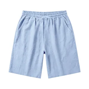 Detail view of light blue men's linen shorts with drawstring waist and loose fit.