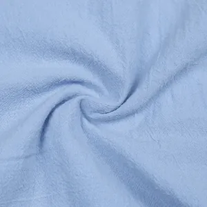 Detailed texture of breathable light blue linen fabric for men's casual summer outfit