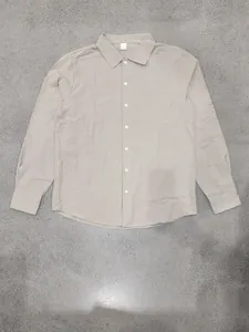 Detailed view of the khaki linen blend long-sleeved shirt showing the button collar