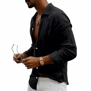 Detail view of men's loose black linen long sleeve shirt with vintage button-up lapel